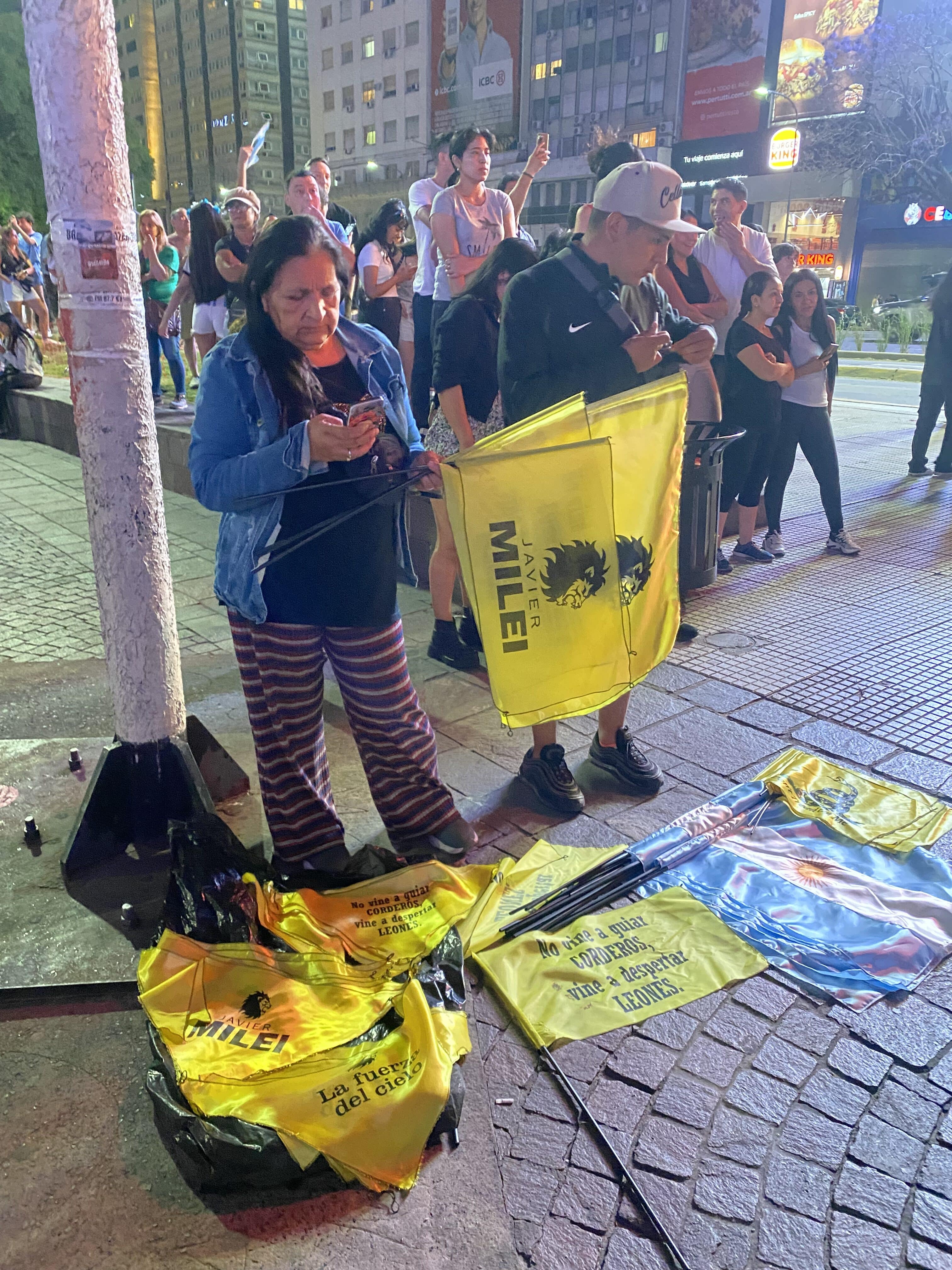 Argentines handing out Milei flags, Nov. 20, 2023. Courtesy: crypto.news